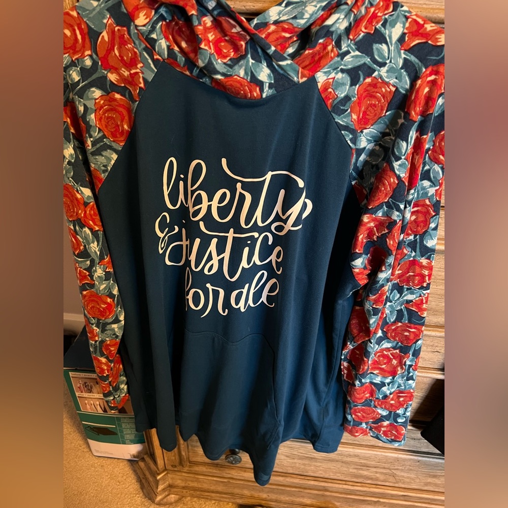 Red, white, and blue hoodie states “Liberty and Justice for all”